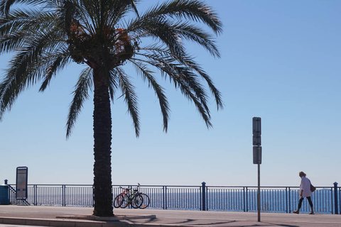 Woman walking along the Promenade des Anglais in Nice